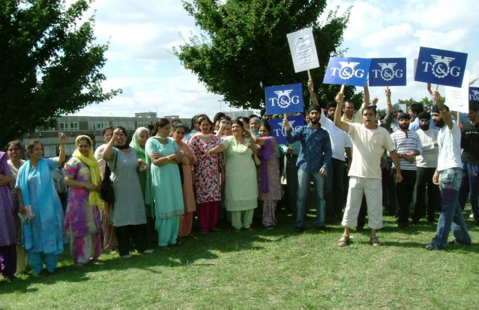 A massive picket line of angry workers determined that their boss will not succeed in destroying the