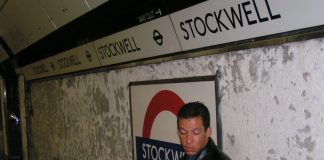 Alex Alessandro Pereira, cousin of Jean Charles de Menezes grieves on the platform at Stockwell Tube station on Sunday 24th July two days after his cousin was murdered by police