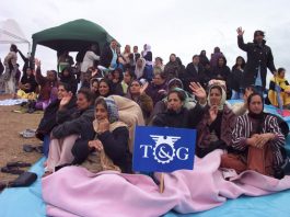 Locked out Gate Gourmet workers determined to get their jobs back, brave the rain on the hill near the factory on Wednesday  morning