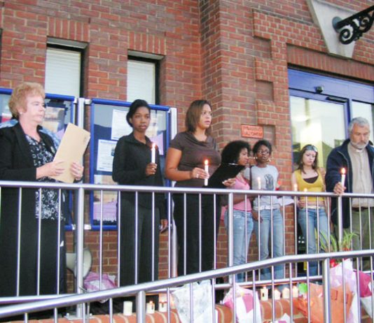 Friends and family of Paul Coker outside Plumstead police station on Tuesday evening – one month after he died. A minute’s silence was held as a mark of respect