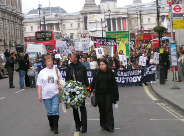 Paul Coker’s mother PATRICIA, UFFC Chair BRENDA WEINBERG and PATRICIA DA SILVA-ARMANI leading the march down Whitehall