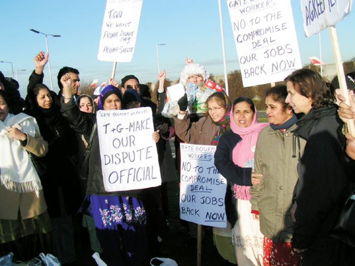 Locked-out Gate Gourmet workers in high spirits welcomed Father Christmas at their mass picket yesterday