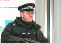 Armed policeman in central London