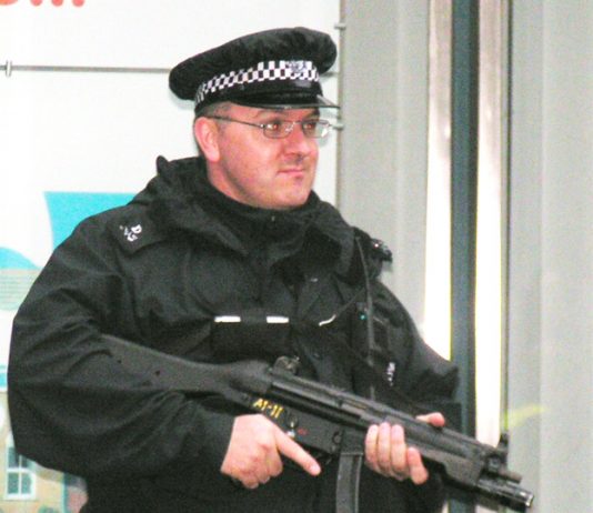 Armed policeman in central London