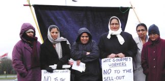 Locked-out Gate Gourmet workers on the picket line at the Beacon roundabout near the factory yesterday midday