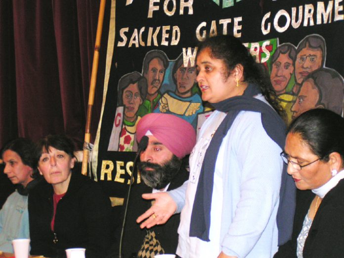 Gate Gourmet locked-out worker PARMJIT BAINS , flanked by HARBINDER SINGH and LAKHINDER SARAN  addressing the News Line- locked-out Gate Gourmet workers Conference in central London last Sunday