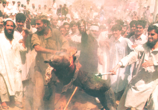 Demonstrators in Karachi burn an effigy of George ‘dog’ Bush  after US forces bombed Afghanistan in September 2001