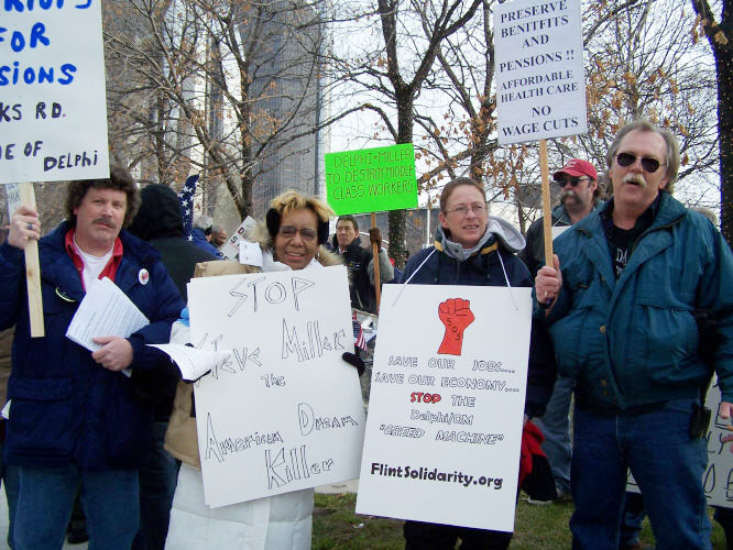 UAW car workers fighting to defend their jobs and pensions lobbying the Detroit motor show
