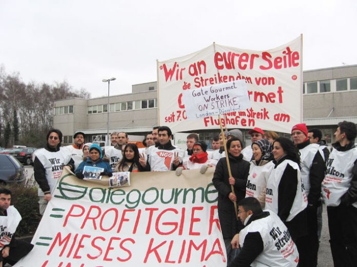 In Dusseldorf yesterday morning two locked-out Gate Gourmet workers from London were welcomed at a mass picket by striking local Gate Gourmet workers