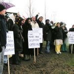 Locked-out Gate Gourmet workers and their supporters held out placards and shouted slogans during their successful picket at Heathrow yesterday