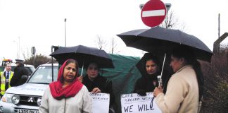 Gate Gourmet locked-out workers picketing the factory yesterday – threatened with arrest by Heathrow Airport police