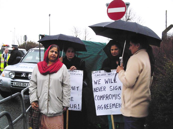 Gate Gourmet locked-out workers picketing the factory yesterday – threatened with arrest by Heathrow Airport police