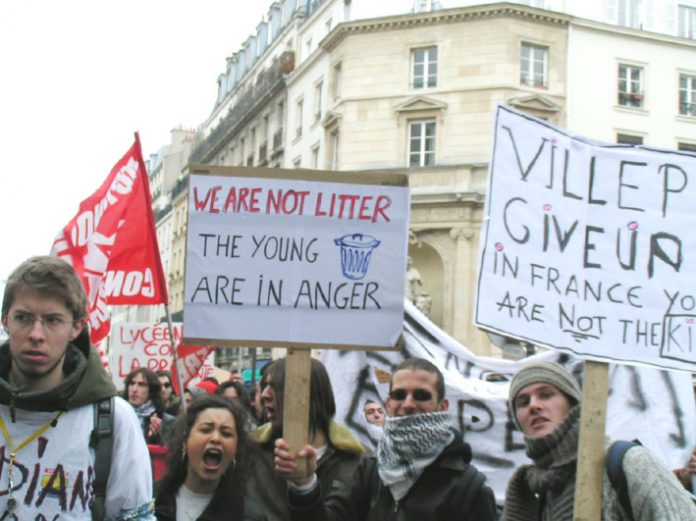 French youth with placards made by English language students marching through Paris on Thursday March 16