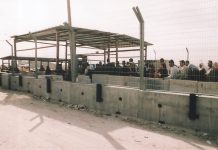 Palestinians queue at the Qalandiya Israeli army checkpoint on the outskirts of Ramallah – Israel now declare it to be a frontier post