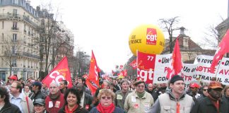 Members of the CGT, France’s largest trade union federation, arrive at Place d’Italie at the end of Tuesday’s demonstration