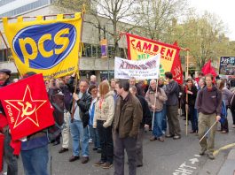 Peretz Continues With ‘Extrajudicial Killings’ PCS banner on the May Day demonstration in London – PCS members were on strike last week against thousands of job cuts engineered by Brown