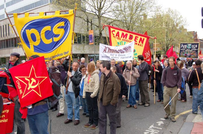 PCS banner on the May Day demonstration in London – PCS members were on strike last week against thousands of job cuts engineered by Brown