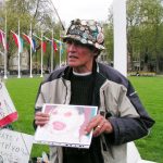 Brian Haw holding the photograph of an infant victim of the continuing war in Afghanistan – the baby was one of triplets