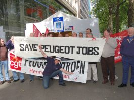 French and British workers with the CGT and TGWU/Amicus banners deliver a clear message to Peugeot shareholders