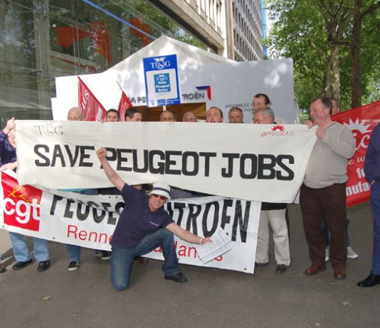 French and British workers with the CGT and TGWU/Amicus banners deliver a clear message to Peugeot shareholders
