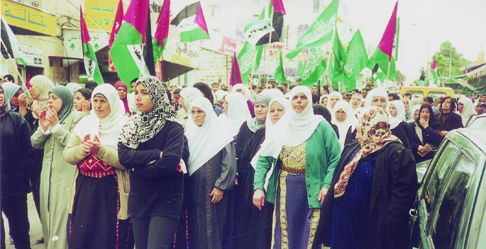 Hamas and Palestinian flags at a funeral in Ramallah for youth killed by the Israeli occupation forces