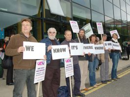 Lecturers with a clear message as the march assembles outside South Bank University