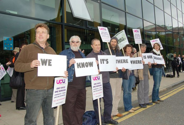 Lecturers with a clear message as the march assembles outside South Bank University