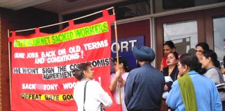 Gate Gourmet locked-out workers yesterday angrily confronting their TGWU convenor Dhillon, outside the Hillingdon TGWU office demanding that their dispute must be made official and that they must also receive dispute pay