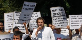 Demonstrators in Forest Gate denounce Blair as the terrorist and demand the police apologise for the raid on a local working class family