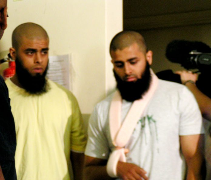 ABUL KOYAIR and his wounded brother MOHAMMED ABDUL KAHAR after giving a press conference in Forest Gate yesterday