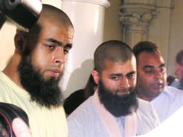 The two brothers ABUL KOYAIR and MOHAMMED ABDUL KAHAR, who suffered throughout the press conference from the effect of his injuries