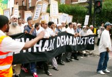 The front of the 4,000-strong demonstration against the police raid in Forest Gate making its way through Newham yesterday