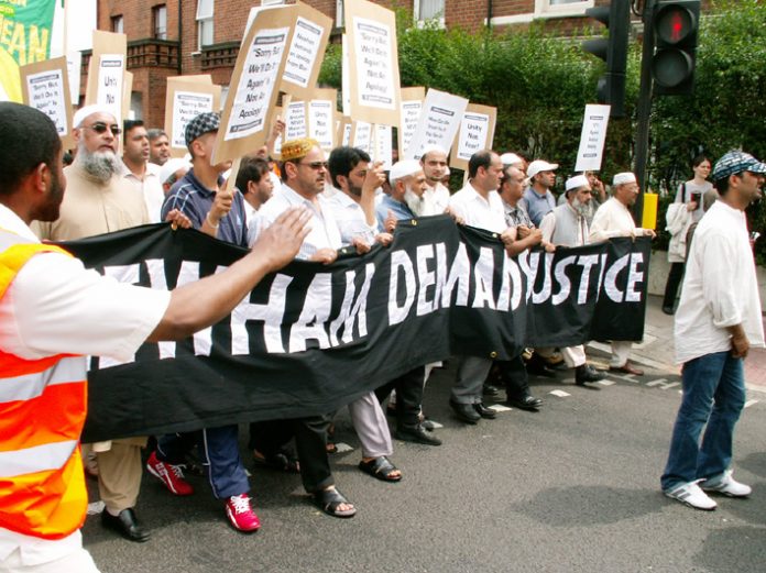 The front of the 4,000-strong demonstration against the police raid in Forest Gate making its way through Newham yesterday