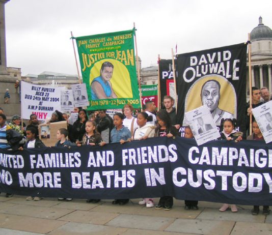 United Families and Friends marchers assemble for their anniversary march in Trafalgar Square last October (above) and (below) banners with names of those who were killed whilst in prison, on the march to Downing Street