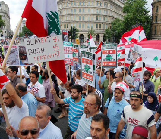 Marchers on the 30,000-strong ‘Stop Israel’s attack on Lebanon’  demonstration in London last Saturday condemn US president Bush and Israeli Premier Olmert as terrorists