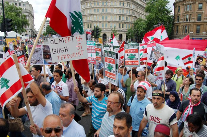 Marchers on the 30,000-strong ‘Stop Israel’s attack on Lebanon’  demonstration in London last Saturday condemn US president Bush and Israeli Premier Olmert as terrorists