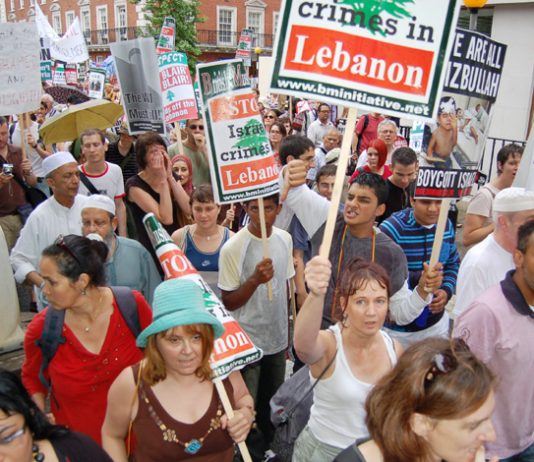 Marchers in London on July 22 condemn the Israeli crimes in Lebanon and Palestine