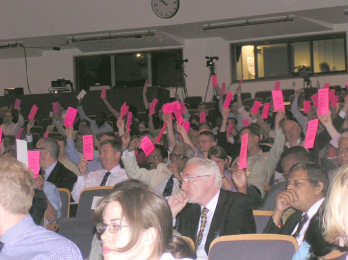 Doctors at the British Medical Association Annual Representative Meeting in June voting to keep privateers out of the NHS