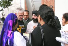 Locked-out Gate Gourmet workers angrily lobbying a member of the TGWU National Executive at their meeting yesterday