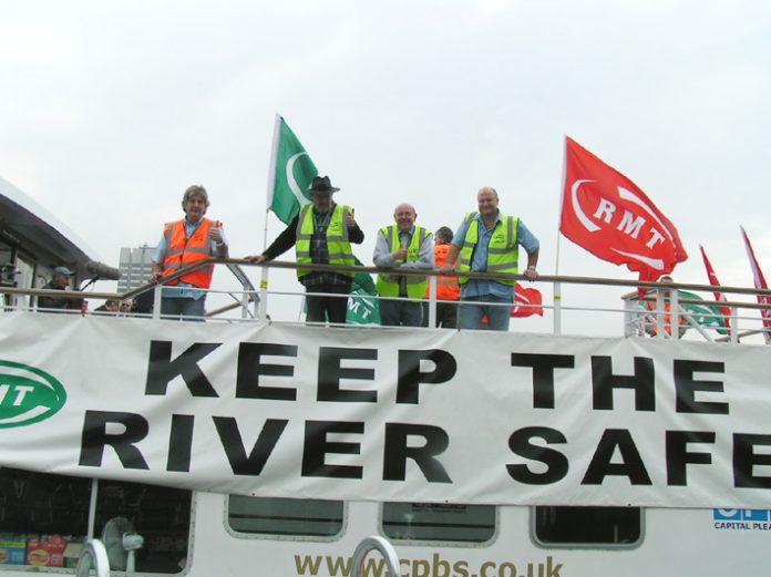 BOB CROW (right) with Thames watermen. He warned that a ‘dilution of safety’ would be met with industrial action
