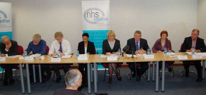 The  platform at the ‘NHS Together’ press conference on Tuesday