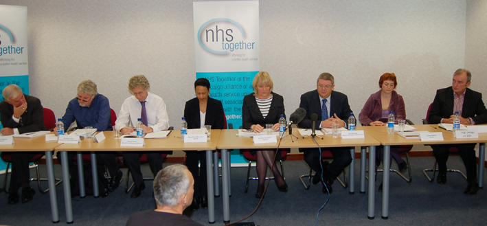 The  platform at the ‘NHS Together’ press conference on Tuesday