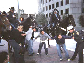 Mounted police assault on the Houston janitors non-violent protest outside the investment bankers JP Morgan Chase buildings – 44 janitors were arrested and four injured