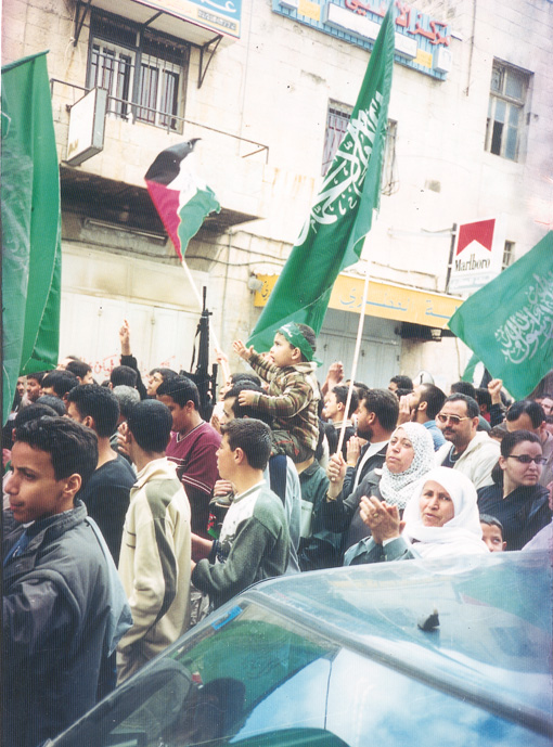Palestinian and Hamas flags on a demonstration in Ramallah against the Israeli occupation