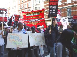 Young Socialists banner on the NUS October 29th demonstration demanding fees are scrapped not capped
