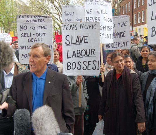 TGWU leader TONY WOODLEY at the May 1st demonstration surrounded by Gate Gourmet locked-out workers whose struggle he betrayed
