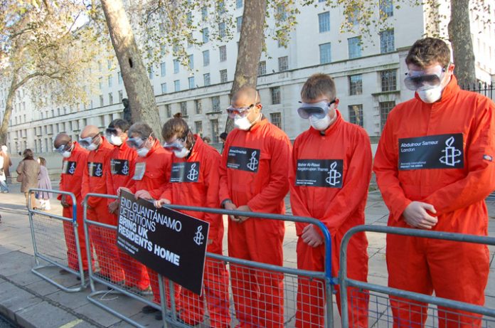 Amnesty protesters as ‘Guantanamo prisoners’ opposite Downing Street