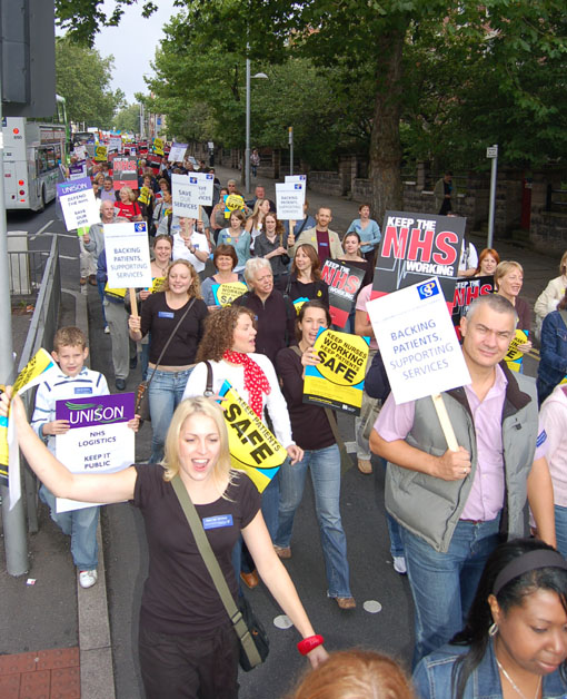 Members of the Chartered Society of Physiotherapists with their placards marching against cuts in Nottingham