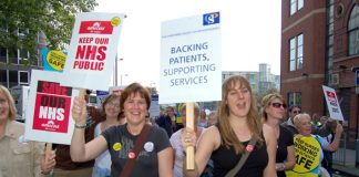 Demonstrating health workers opposing the government’s privatisation of the NHS marching through Nottingham last September