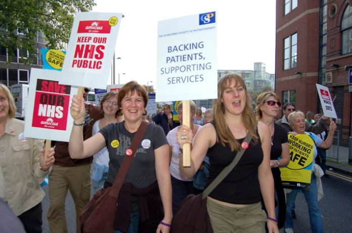 Demonstrating health workers opposing the government’s privatisation of the NHS marching through Nottingham last September